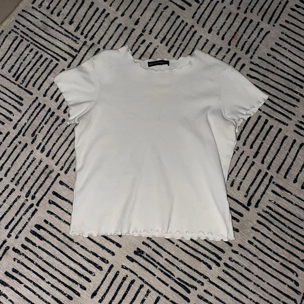 brandy melville White ruffle shirt. very flattering at  the neckline.